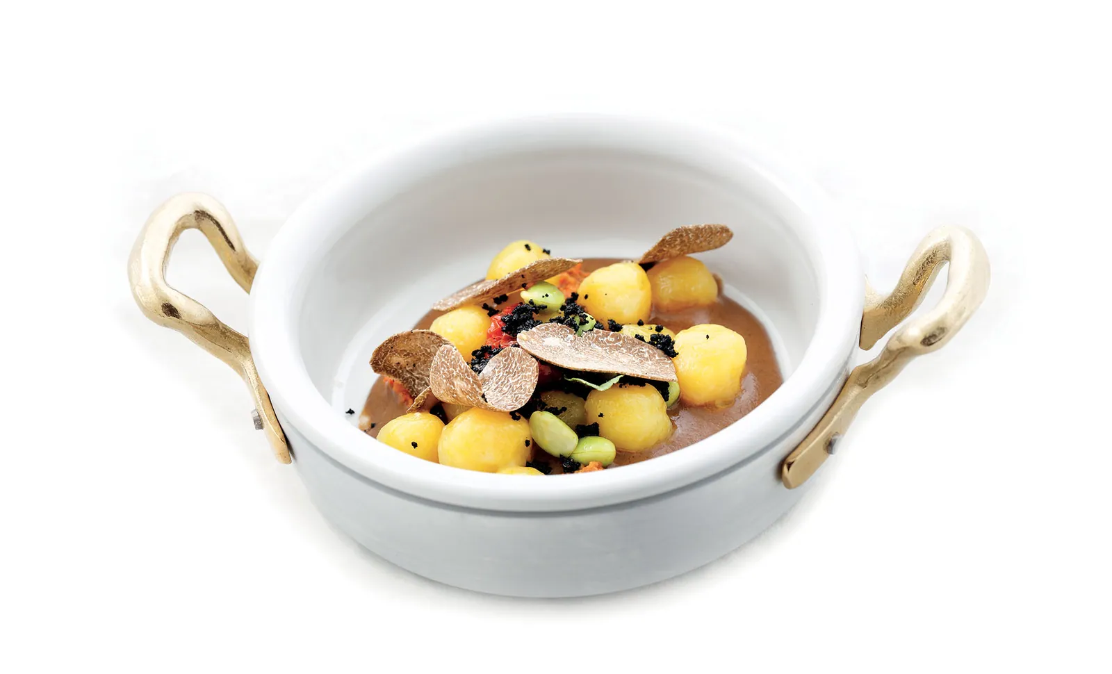 Gnocchetti crema all’aglio nero, ricci di mare, crumble al nero di seppia, pomodorini semisecchi e tartufo